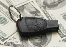 Car Insurance Blog with key remote on money